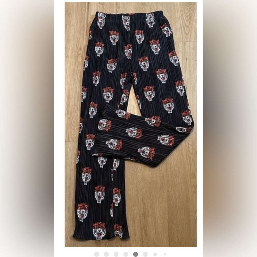 Dressed in Lala black pants with tiger print . Size medium ( top not included)